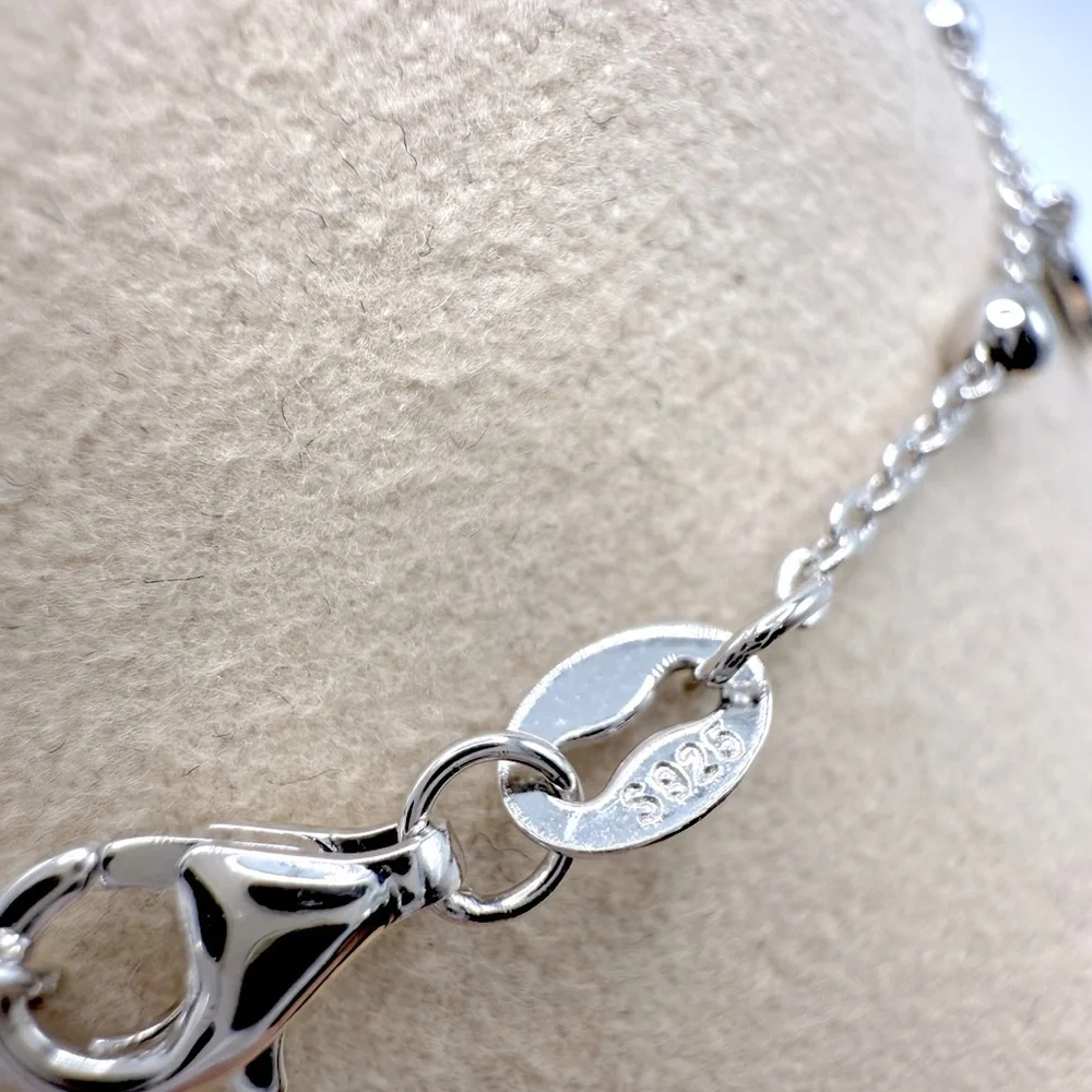 6.75” Dainty .925 Sterling Silver Dangle Eye, Cross and Hamsa Charm Bracelet